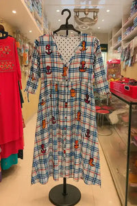Colorful Check Printed Cotton Kurti displayed on hanger